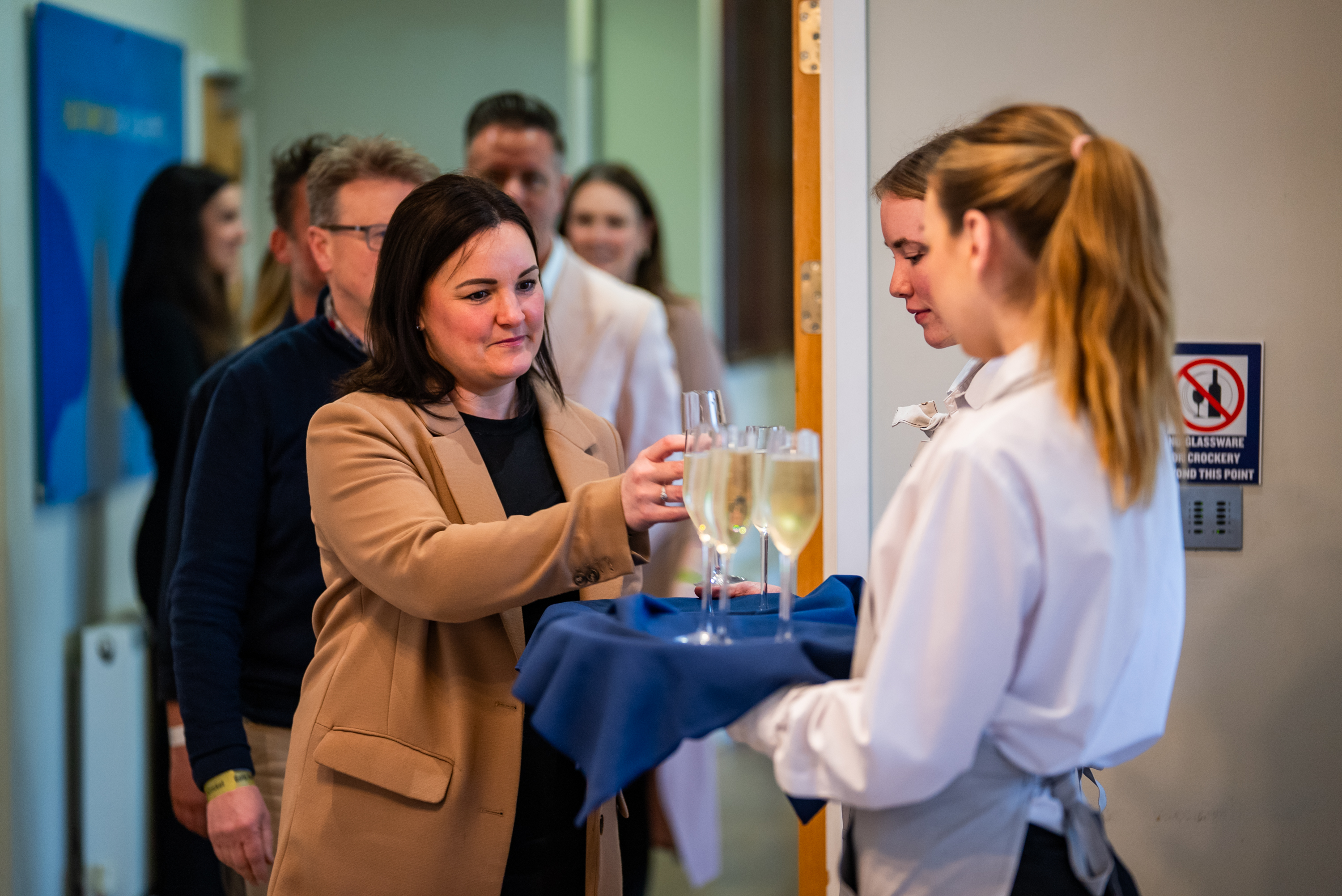 taking their welcome drink