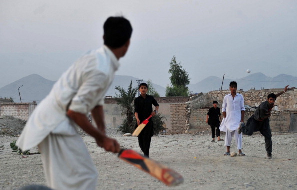 Children play cricket in Jalalabad