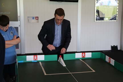 Rob Andrew playing table cricket