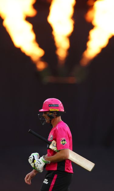 Dan Hughes of Sydney Sixers walking off the field