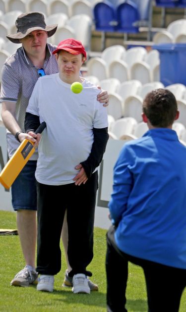 a student playing with a cricket bat and ball at discoverability day 2025