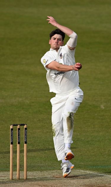 Henry Crocombe bowling.