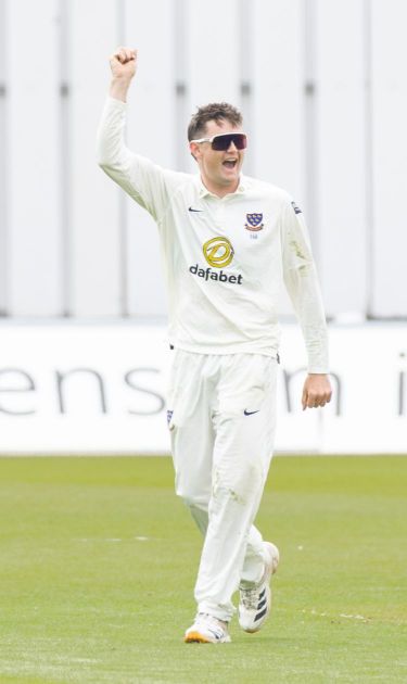 Jack Carson celebrating a wicket