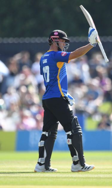 Tom Clark raises his bat