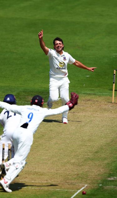 Tom Haines celebrating a wicket.