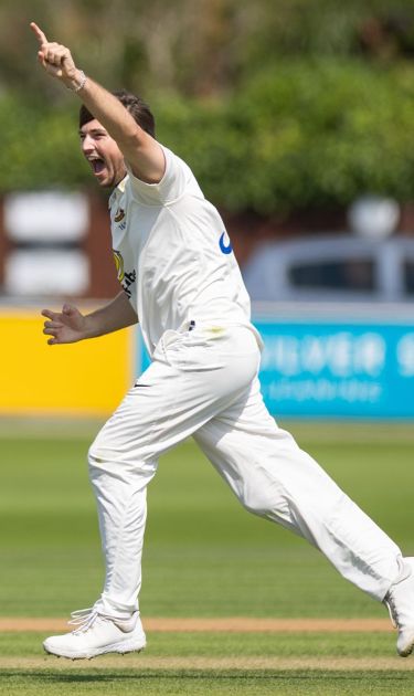 James Coles celebrates a wicket.
