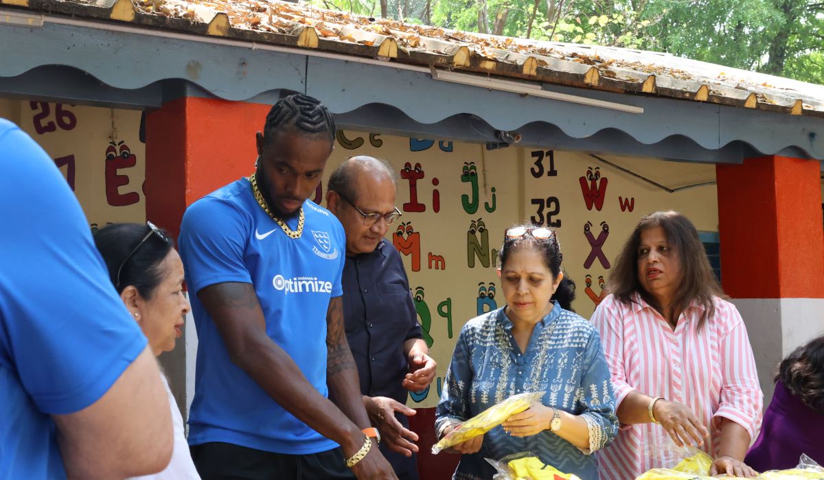 Jofra Archer handing out gifts in India