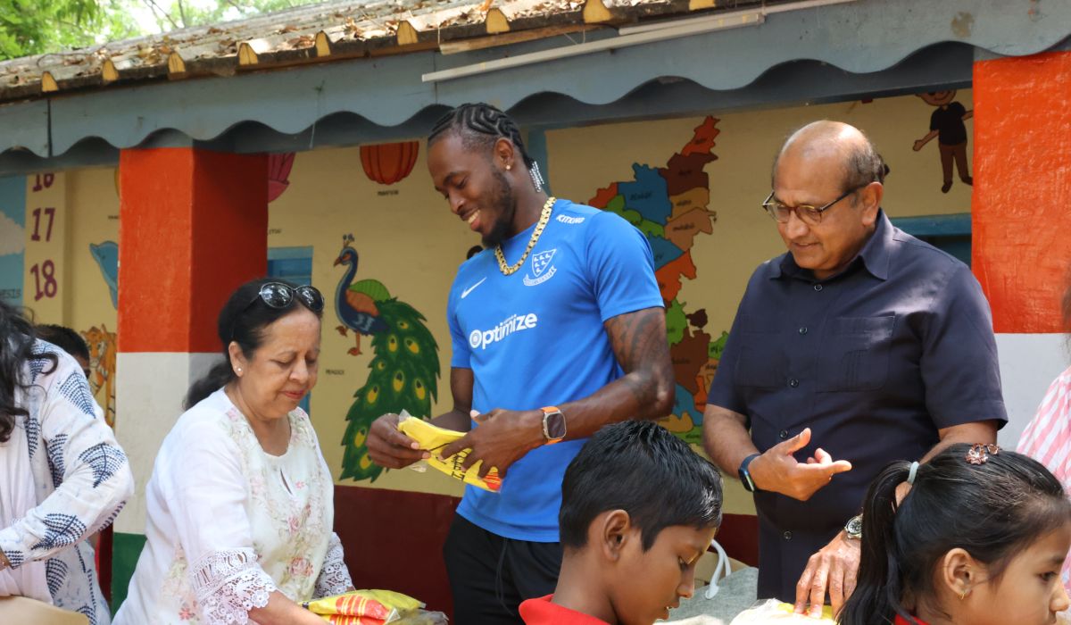 Jofra Archer handing out gifts in India