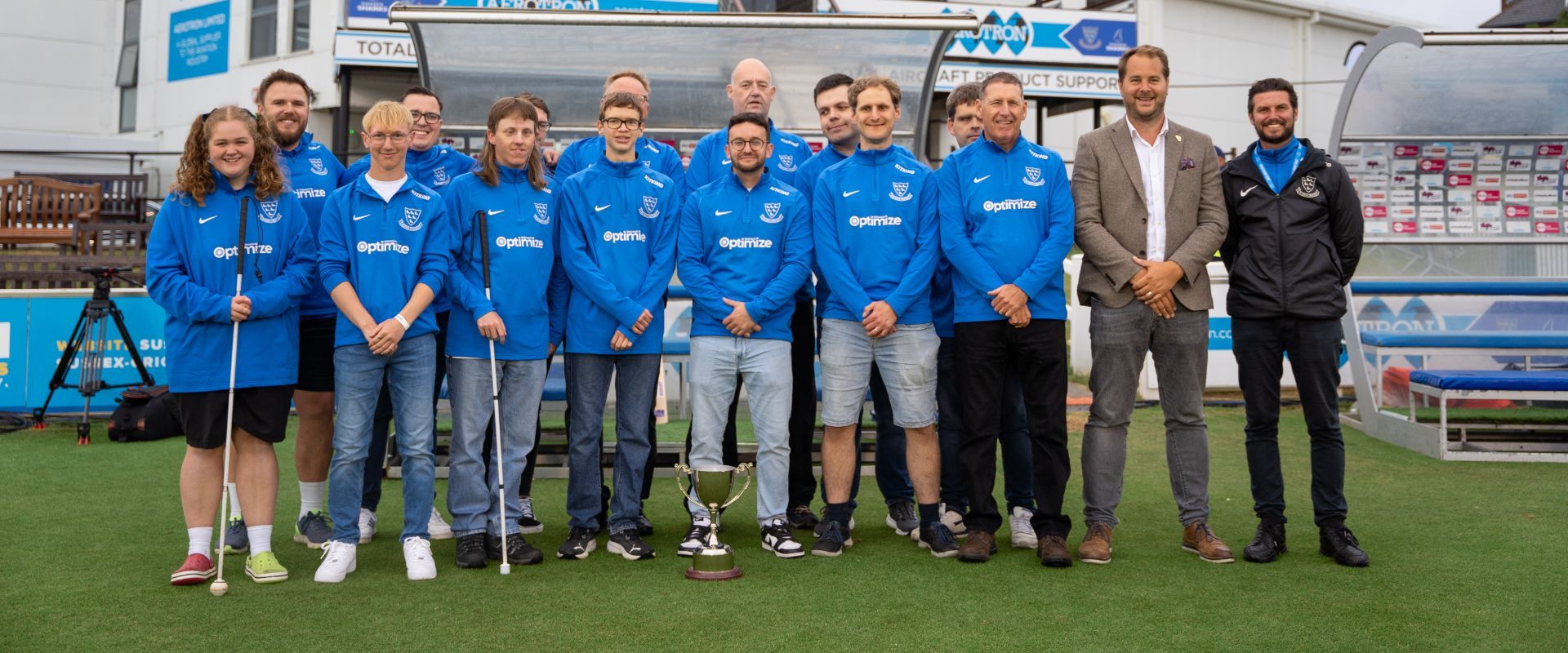 Sussex Sharks VI team line up with their trophy at the 1st central county ground