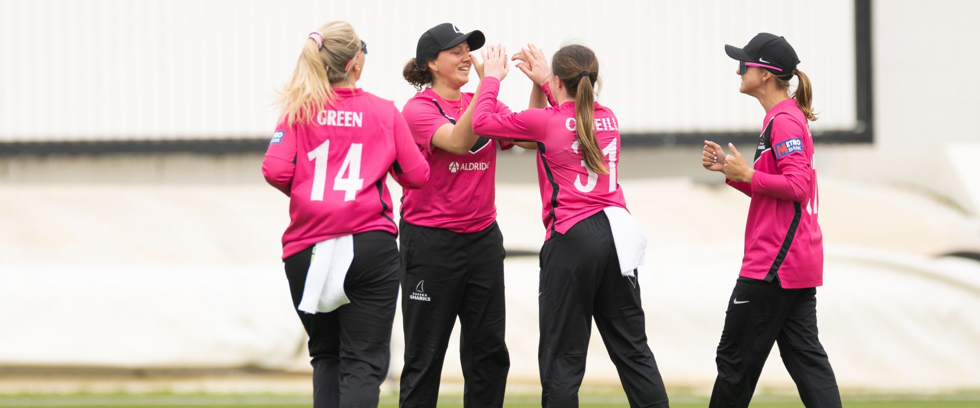 Sussex Sharks Women celebrate taking a wicket against Glamorgan