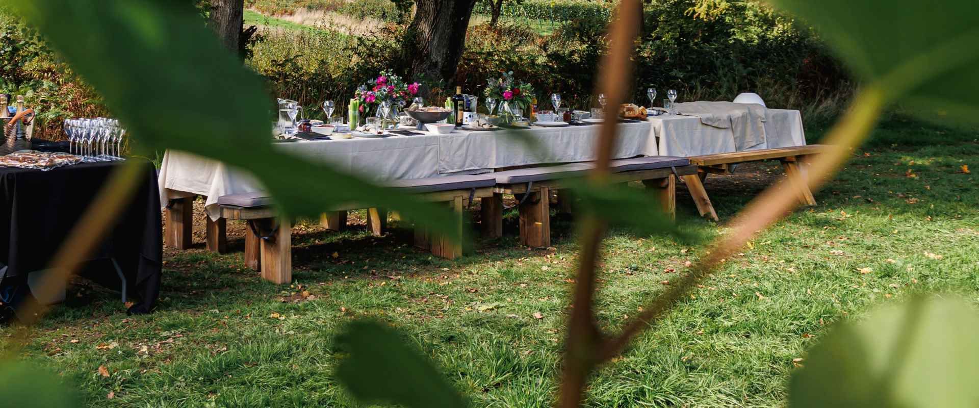 an image of a dressed table with dinner and wine from roebuck estates