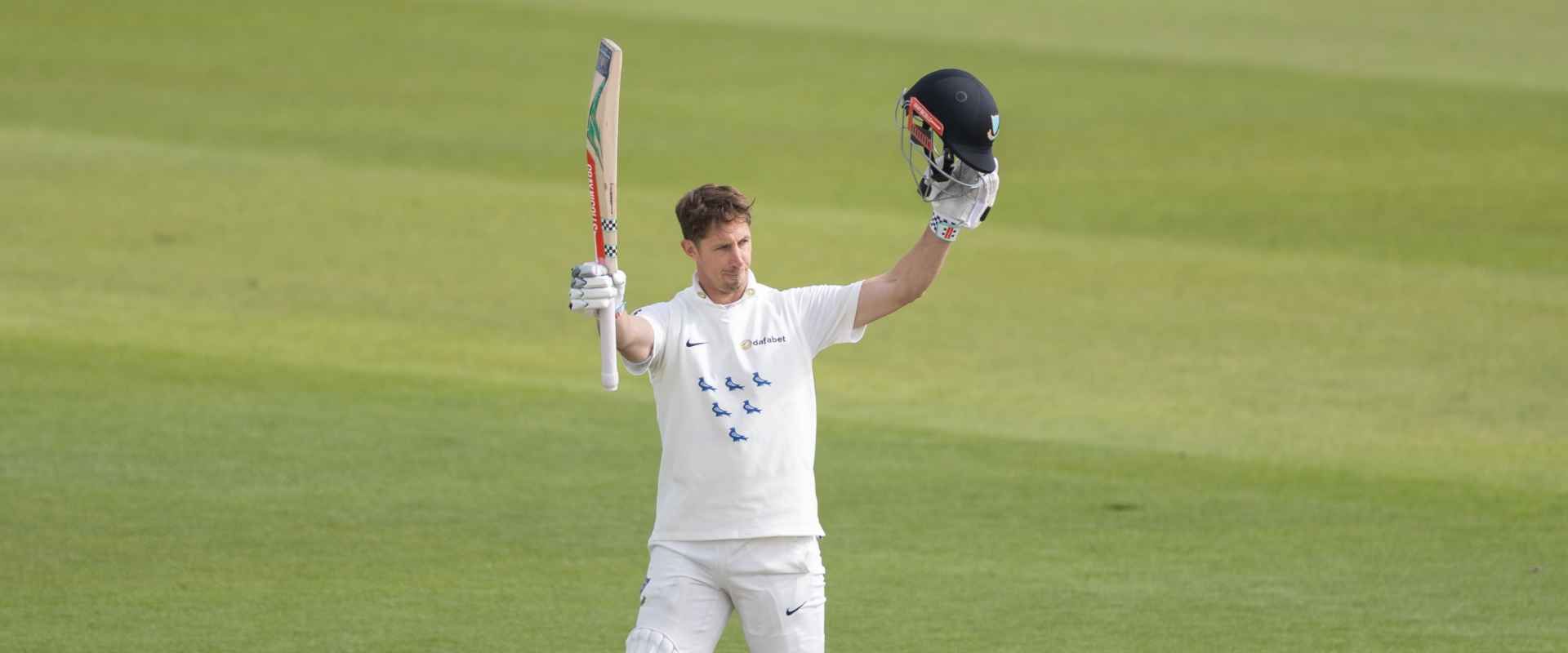 John Simpson raises his bat after another century for Sussex