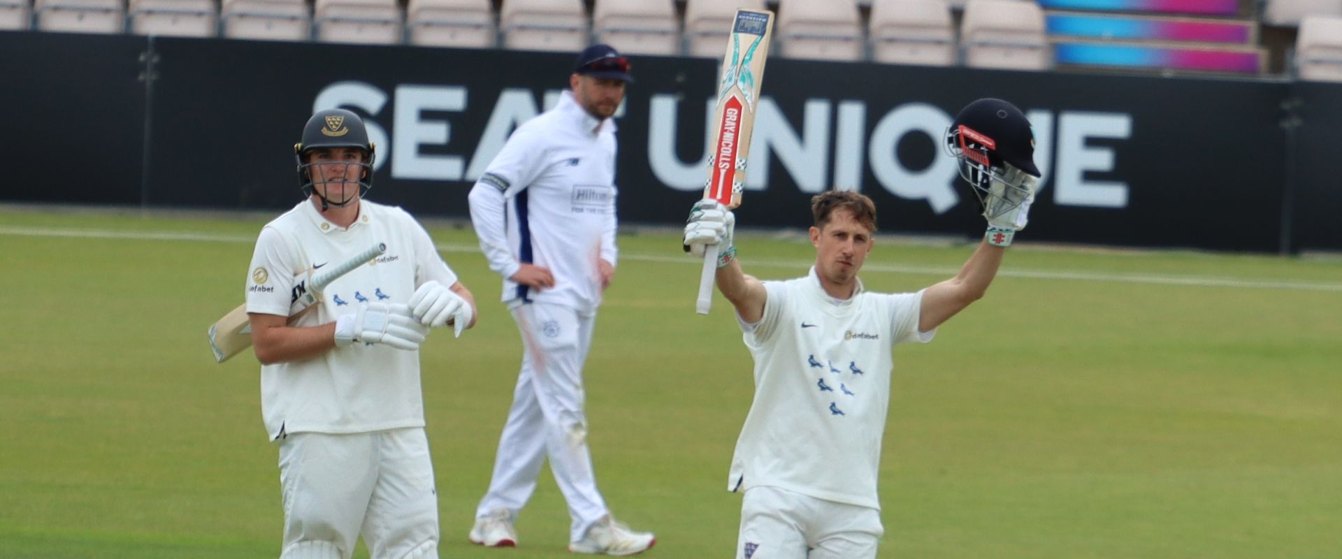 John Simpson celebrates his century against Hampshire.