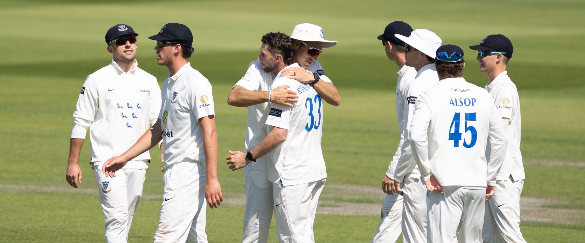 Sussex players celebrate after Fynn Hudson-Prentice takes a wicket