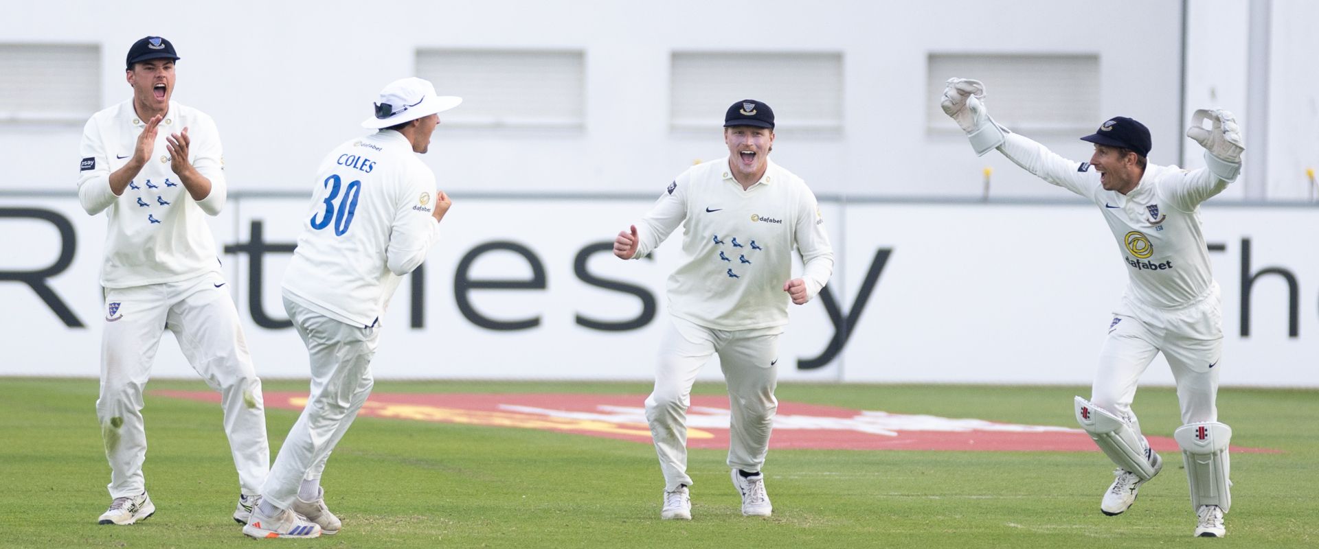 Sussex's slip cordon celebrate a wicket