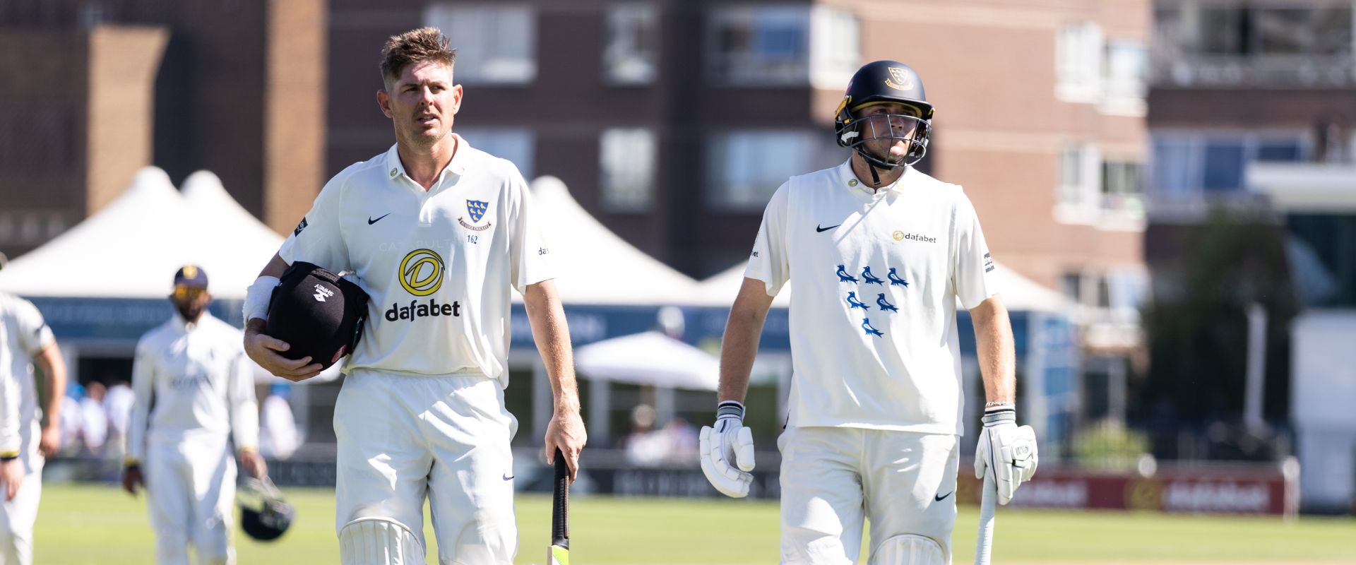 Dan Hughes and James Coles trudge off the field at Tea after a dominant session with the bat.