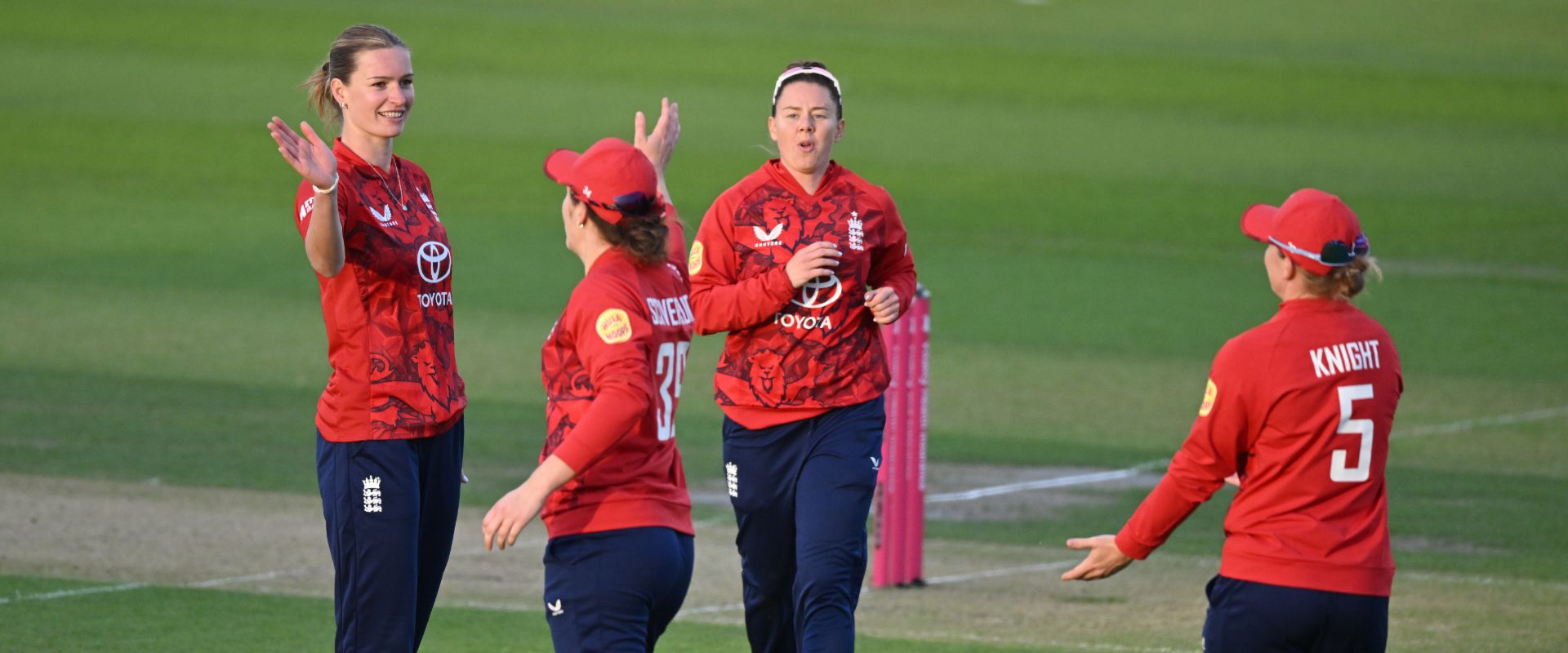 England Women players celebrate after taking a wicket against West Indies Women
