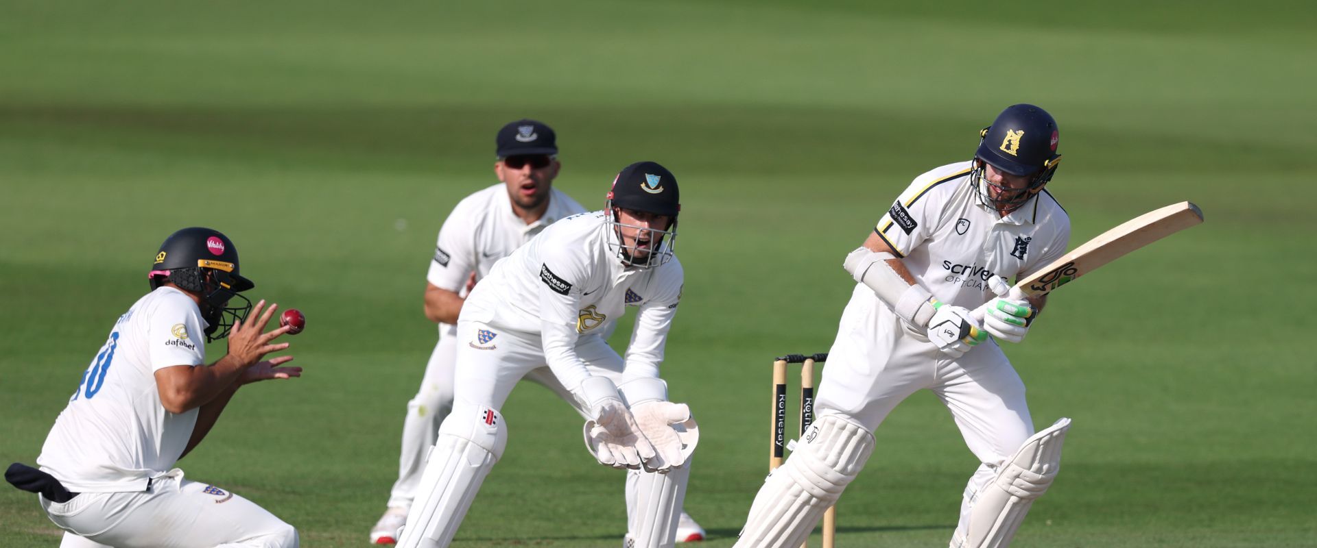 Daniel Ibrahim fields a ball at short leg after Tom Latham plays a shot.