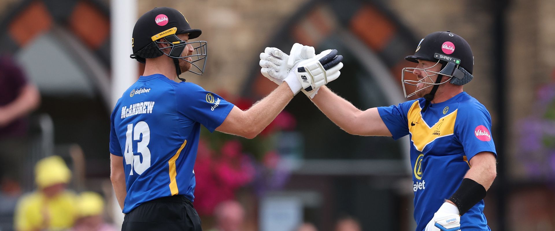 Nathan McAndrew and Danny Lamb shake hands in celebration over the win against Gloucestershire.