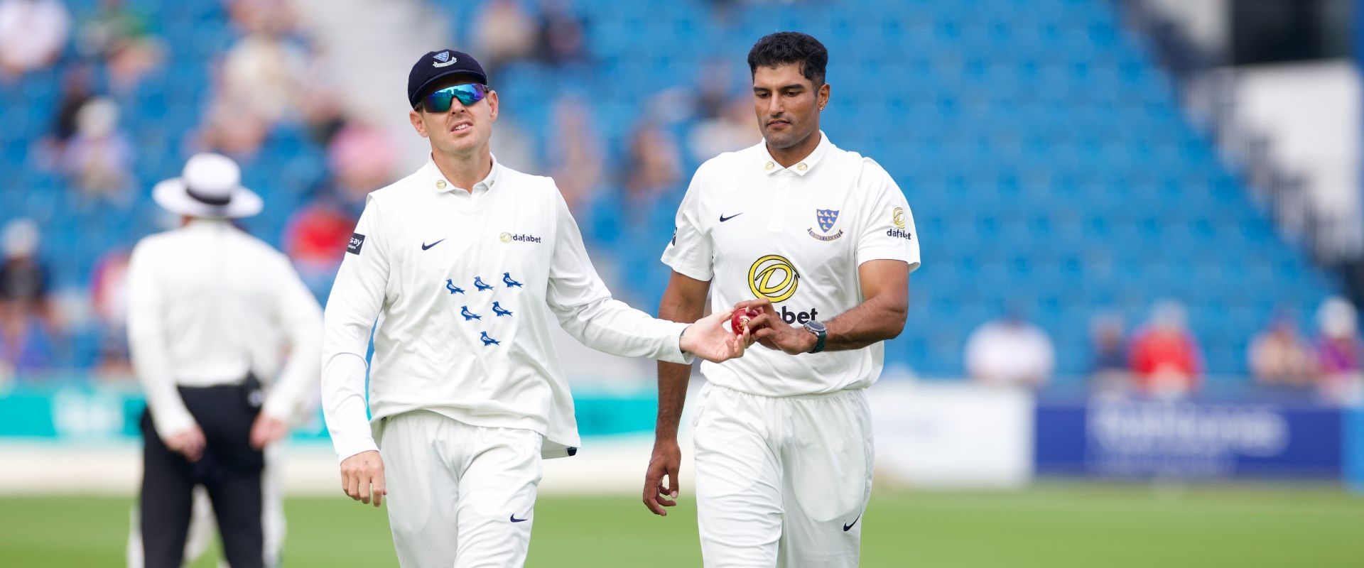 Gurinder Sandhu and Daniel Hughes have a discussion out on the field.