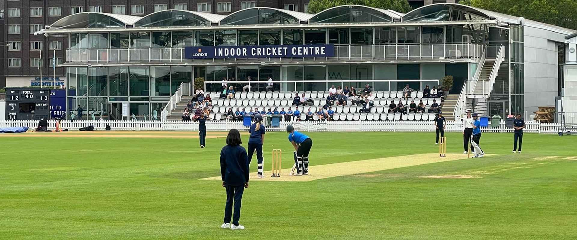 a wide shot of the u13 sussex girls playing at the nursery ground at lords
