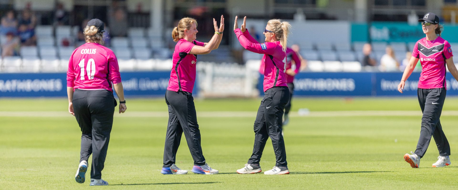 Sussex Women players celebrate after taking a wicket against Middlesex