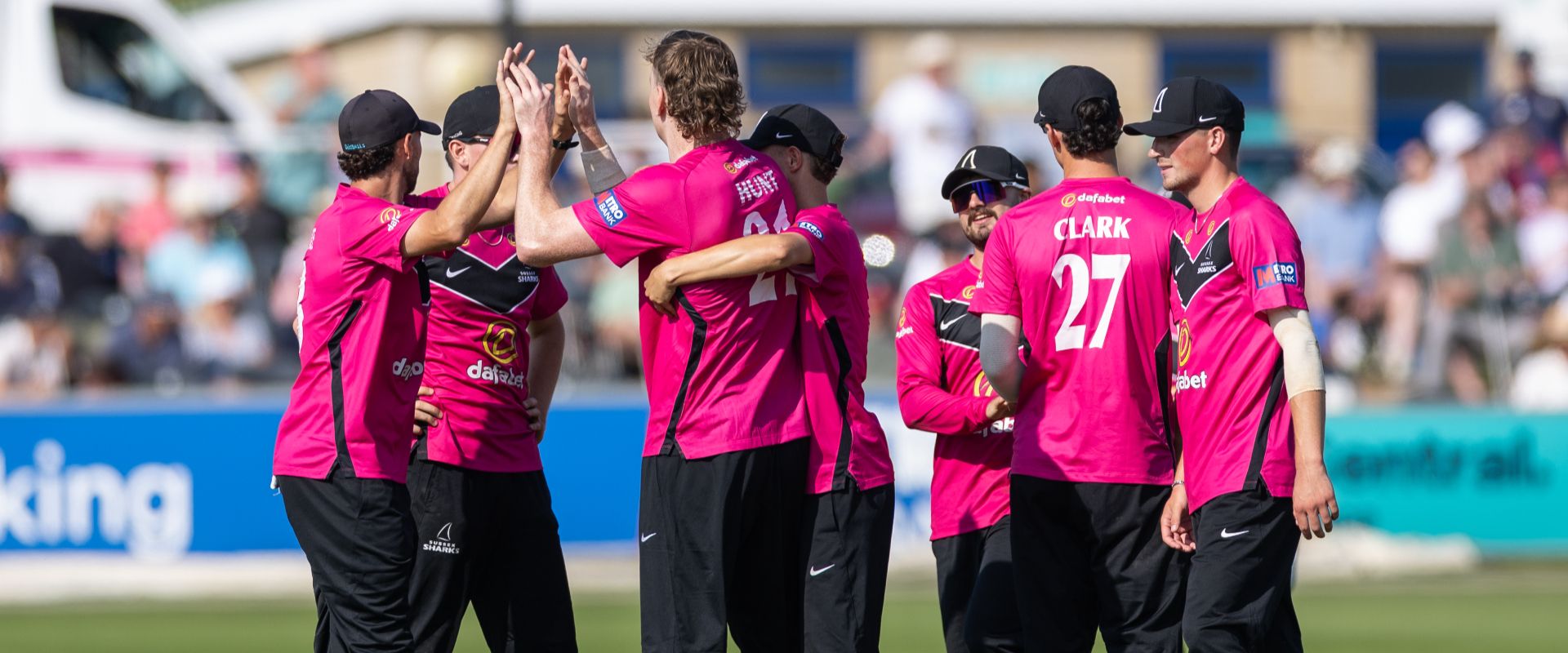 Sussex players celebrate after taking a wicket against Lancashire