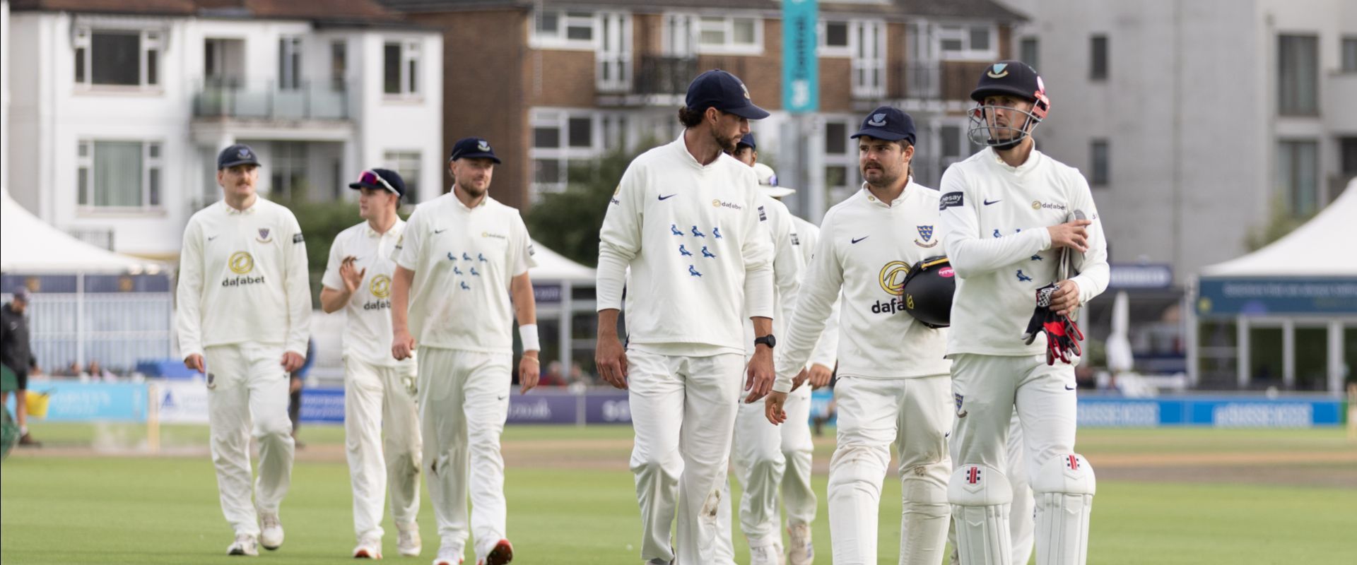 Sussex players walk off the field at Hove.