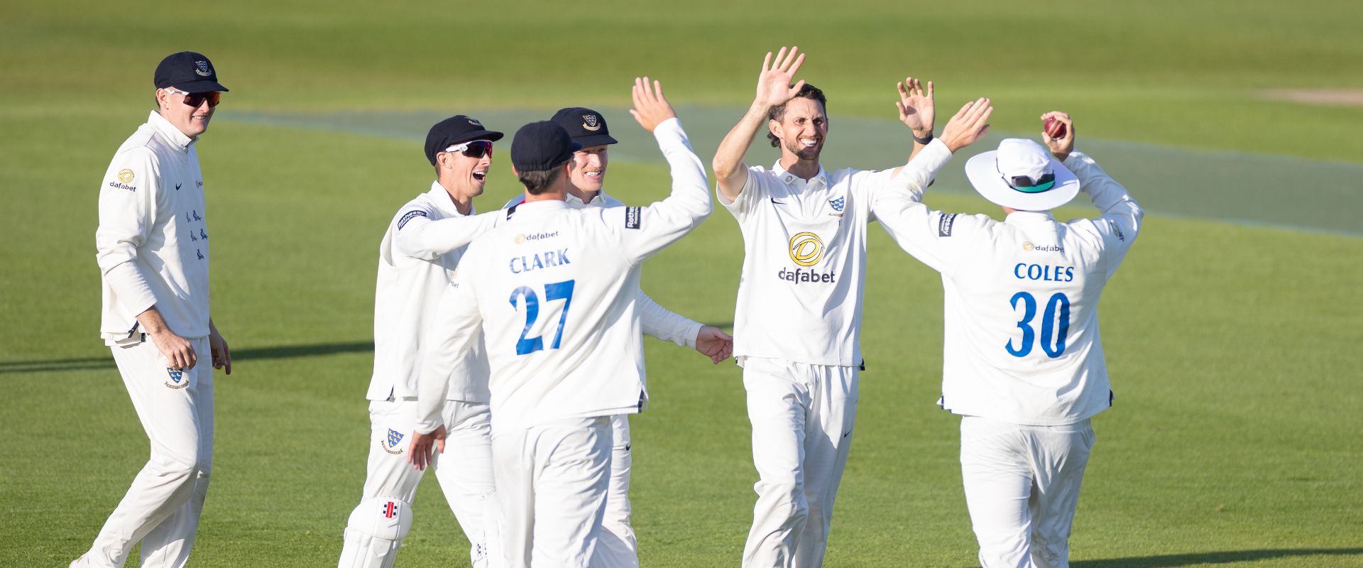 Sussex players celebrate taking a wicket against Somerset in the County Championship