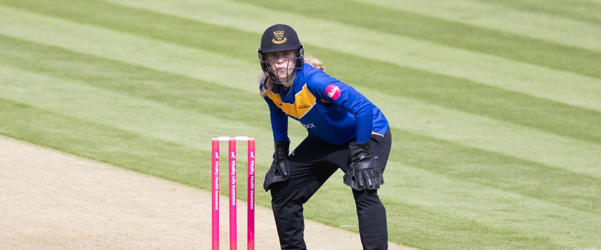 Mollie Adams stands at the stumps while wicket keeping for Sussex in the Vitality Blast.
