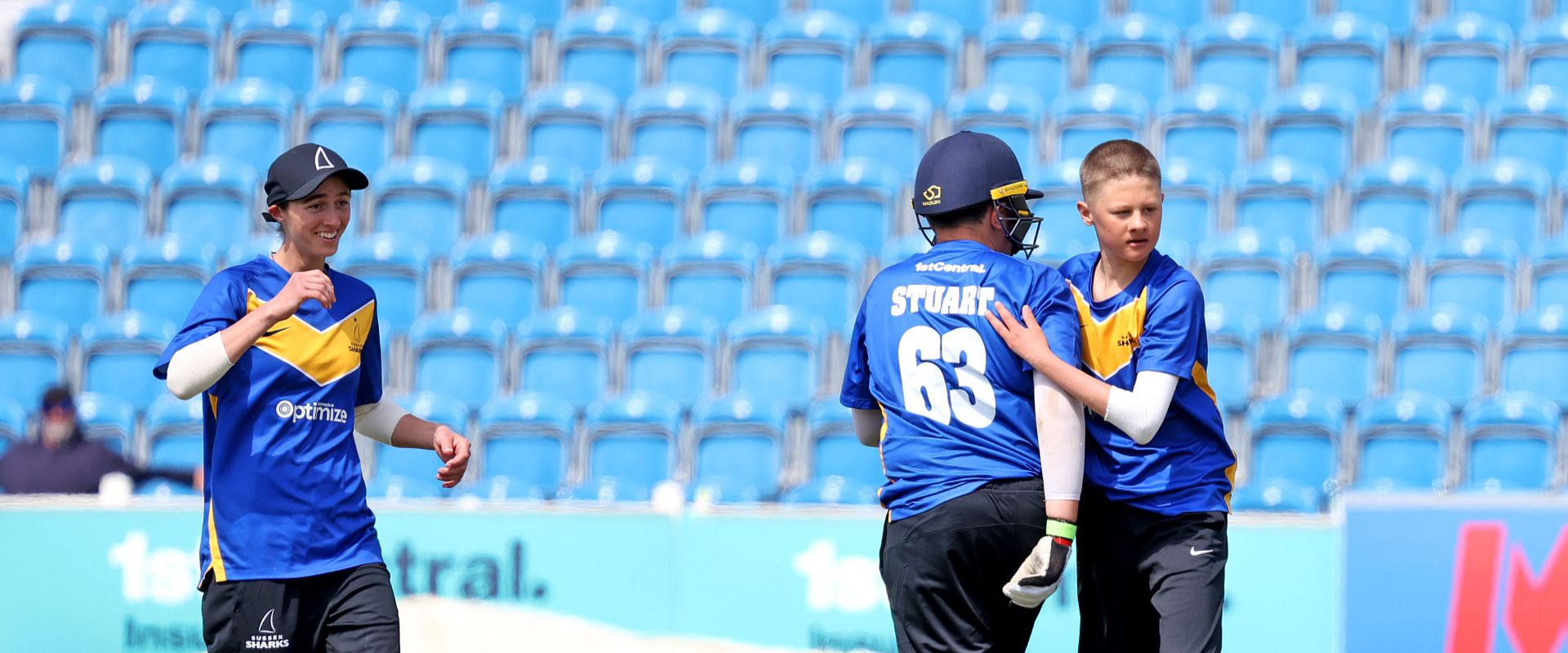 jake vosloo celebrates a wicket with team mates at Hove