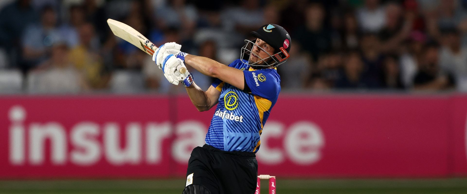 John Simpson batting.