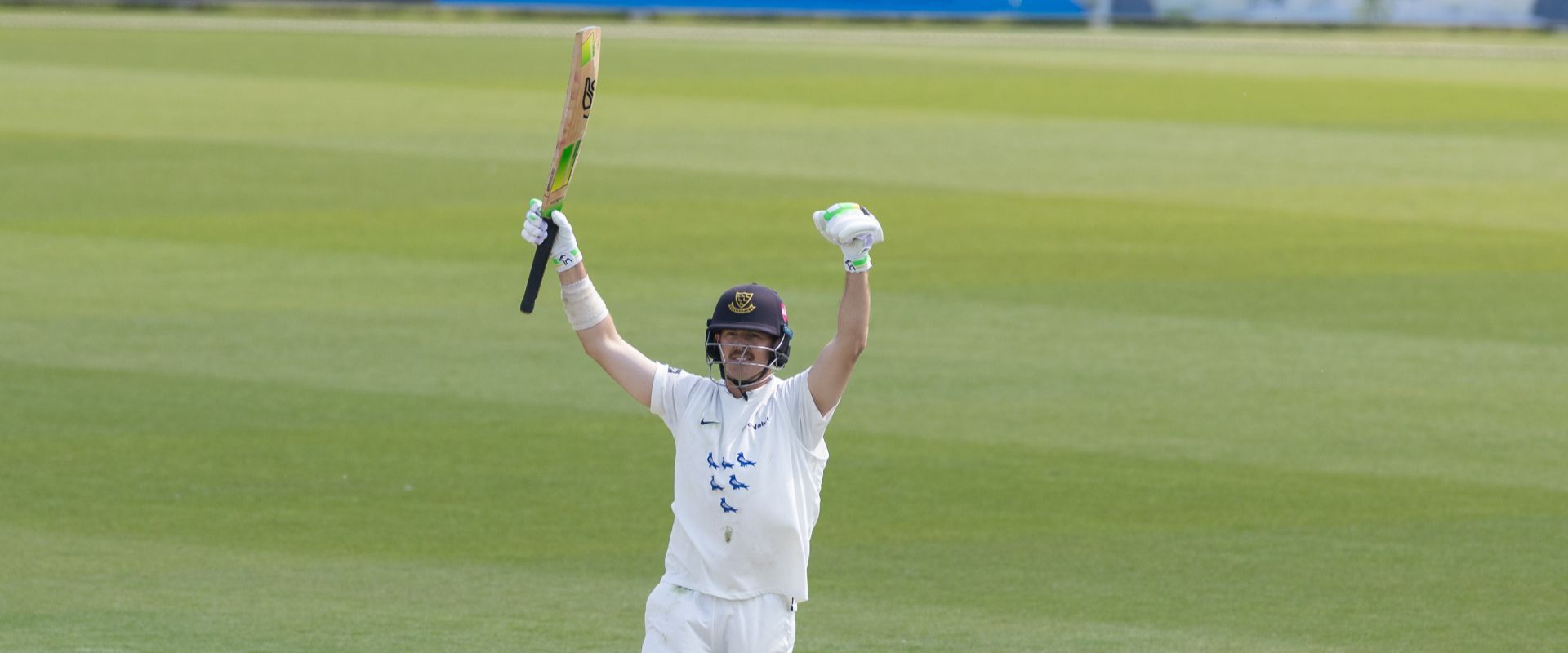 Daniel Hughes celebrates his century.