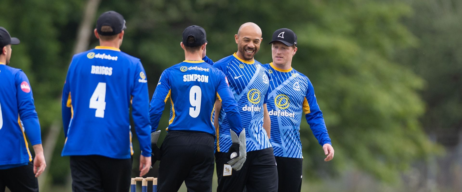 Tymal Mills celebrates with his teammates