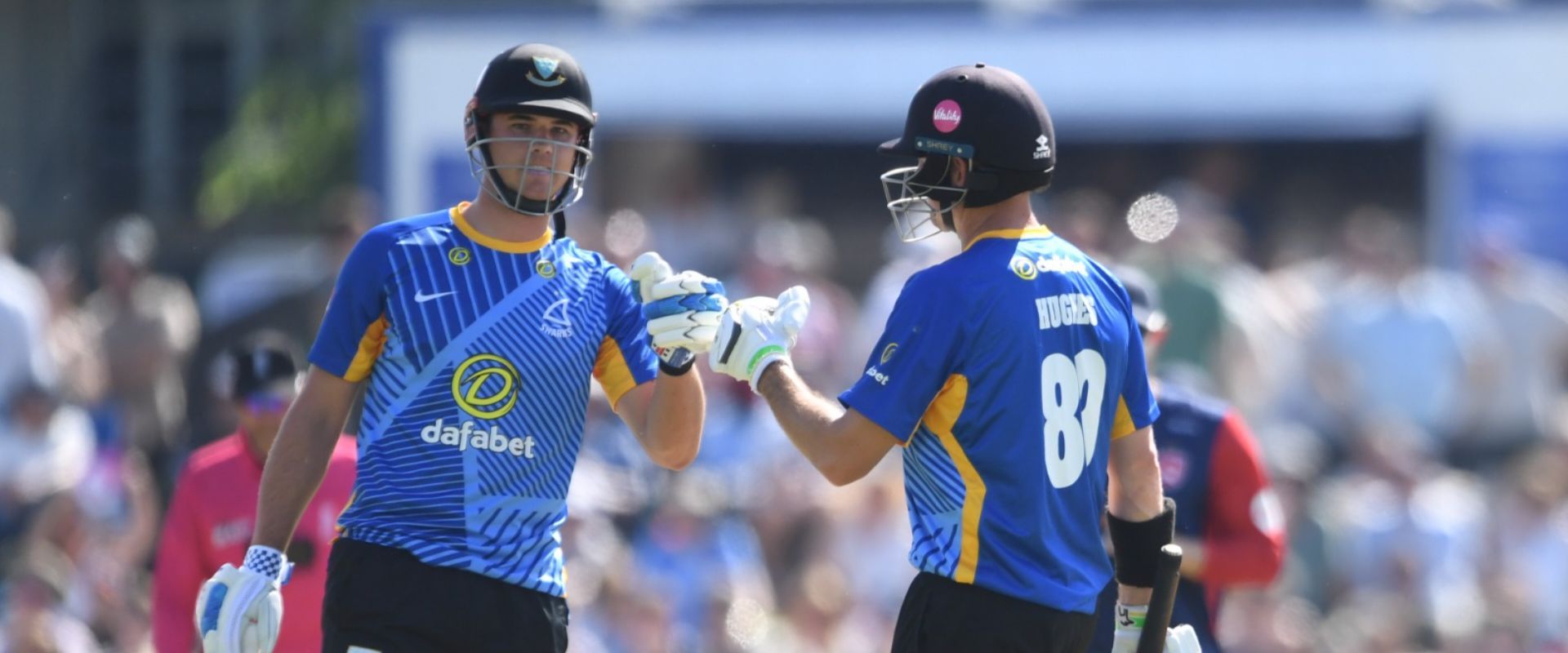 Tom Clark bats with Dan Hughes