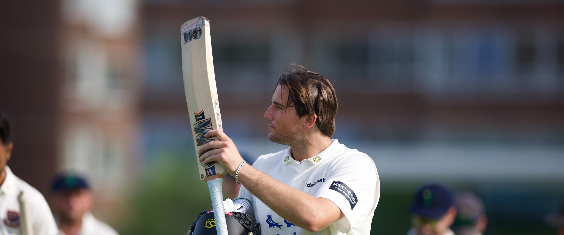 James Coles raises the bat