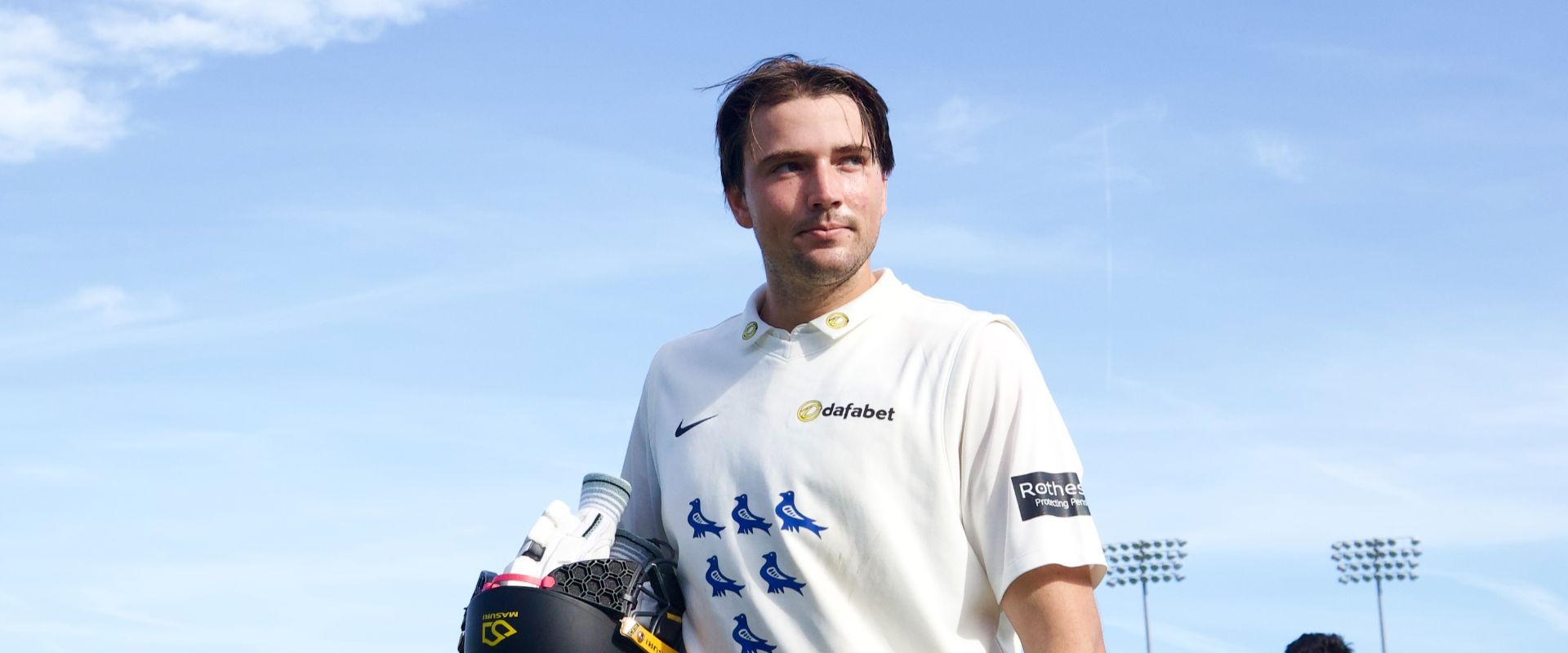 James Coles acknowledges supporters as he walks off after hitting a double century against Glamorgan