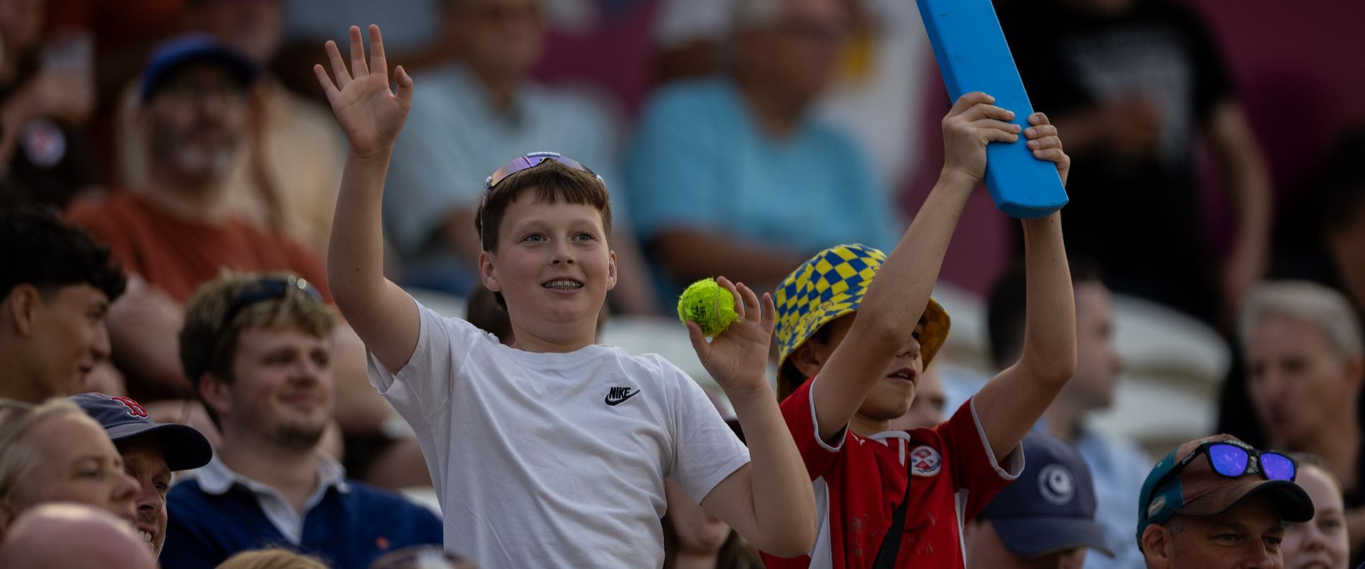 Children in the crowd enjoying a T20 match.