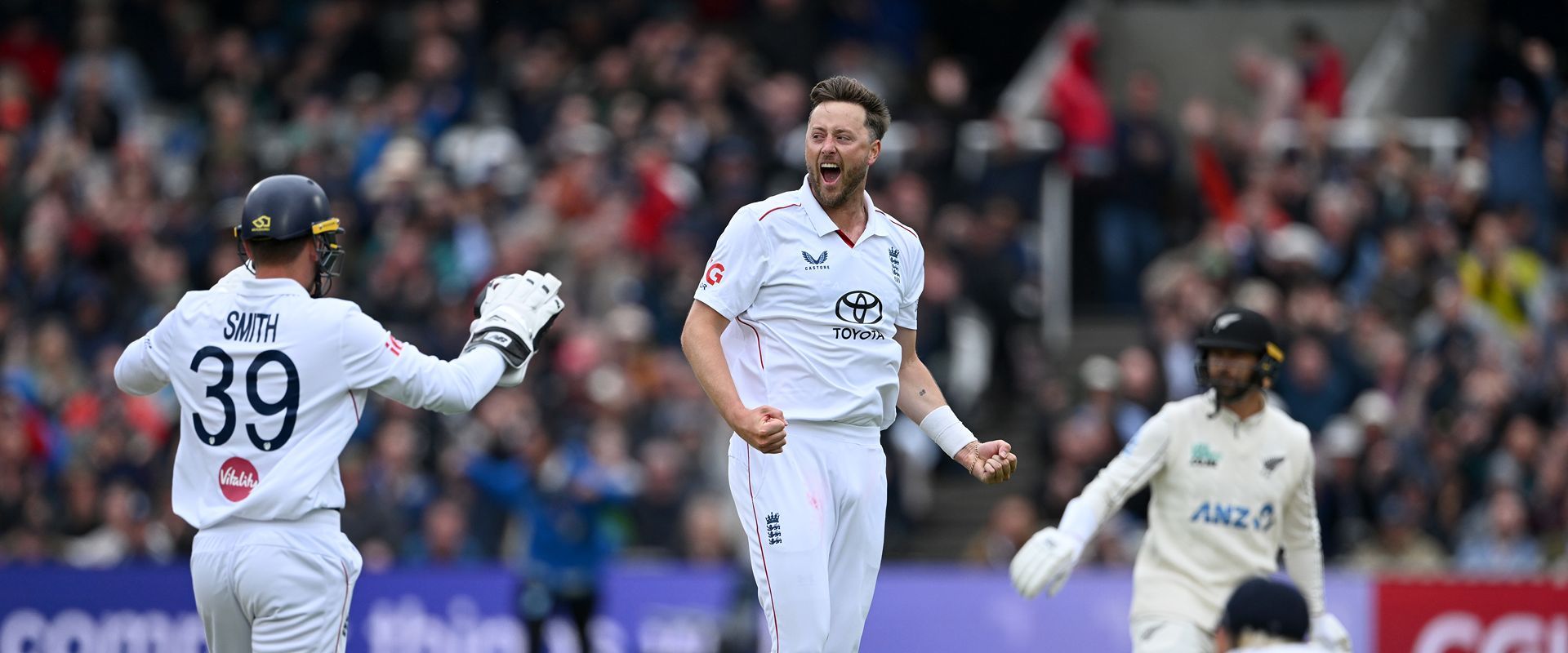 Ollie Robinson celebrating a wicekt for England.