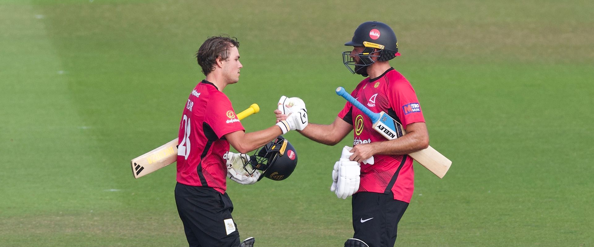 Charlie Tear celebrates his century with Jack Leaning