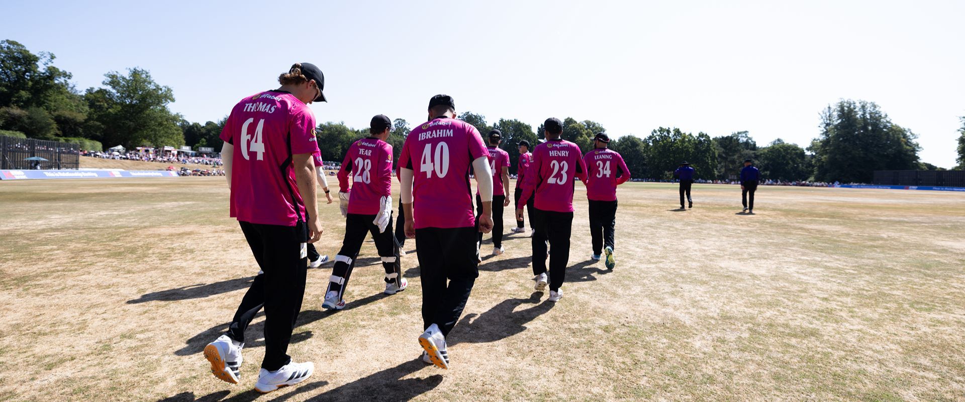 Sussex Sharks players making their way onto the field.