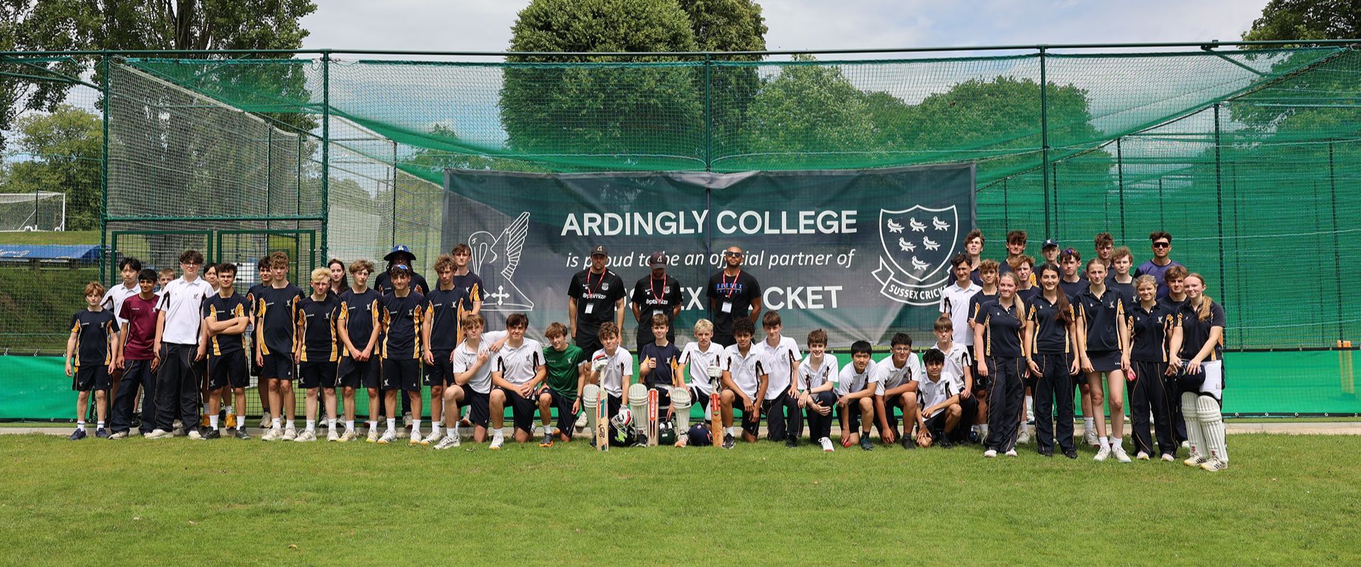 A group photo outside the nets at Ardingly College.