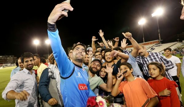 Rashid Khan and supporters