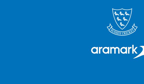 Sussex cricket logo on a blue background with Aramark, our new food provider's logo