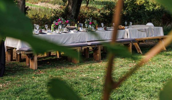 an image of a dressed table with dinner and wine from roebuck estates