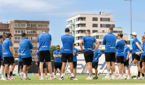 Sussex men's team in a huddle at hove before a game