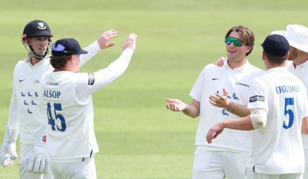 Sussex players celebrate James Coles' first wicket against Hampshire.
