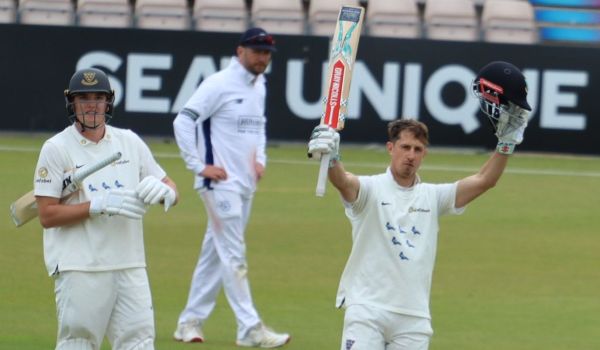 John Simpson celebrates his century against Hampshire.