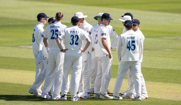 Sussex players gather to celebrate a wicket during the match against Worcestershire.