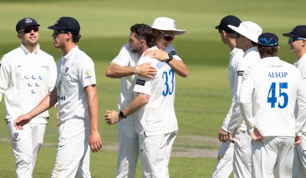 Sussex players celebrate after Fynn Hudson-Prentice takes a wicket